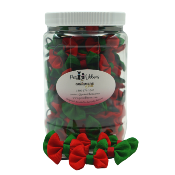 Red and green small dog bows on a rubber band in a jar for groomers